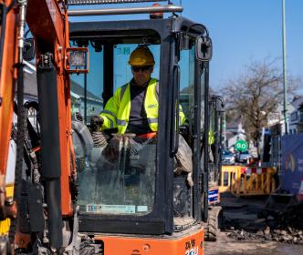 Uisce Éireann worker using a digger