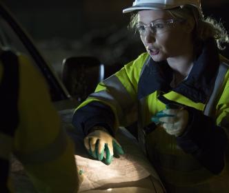 An engineer pointing at a map